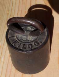 [an old kilogram weight]