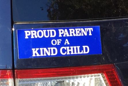 [Bumper sticker saying:
  'Proud Parent
  of a
  Kind Child']